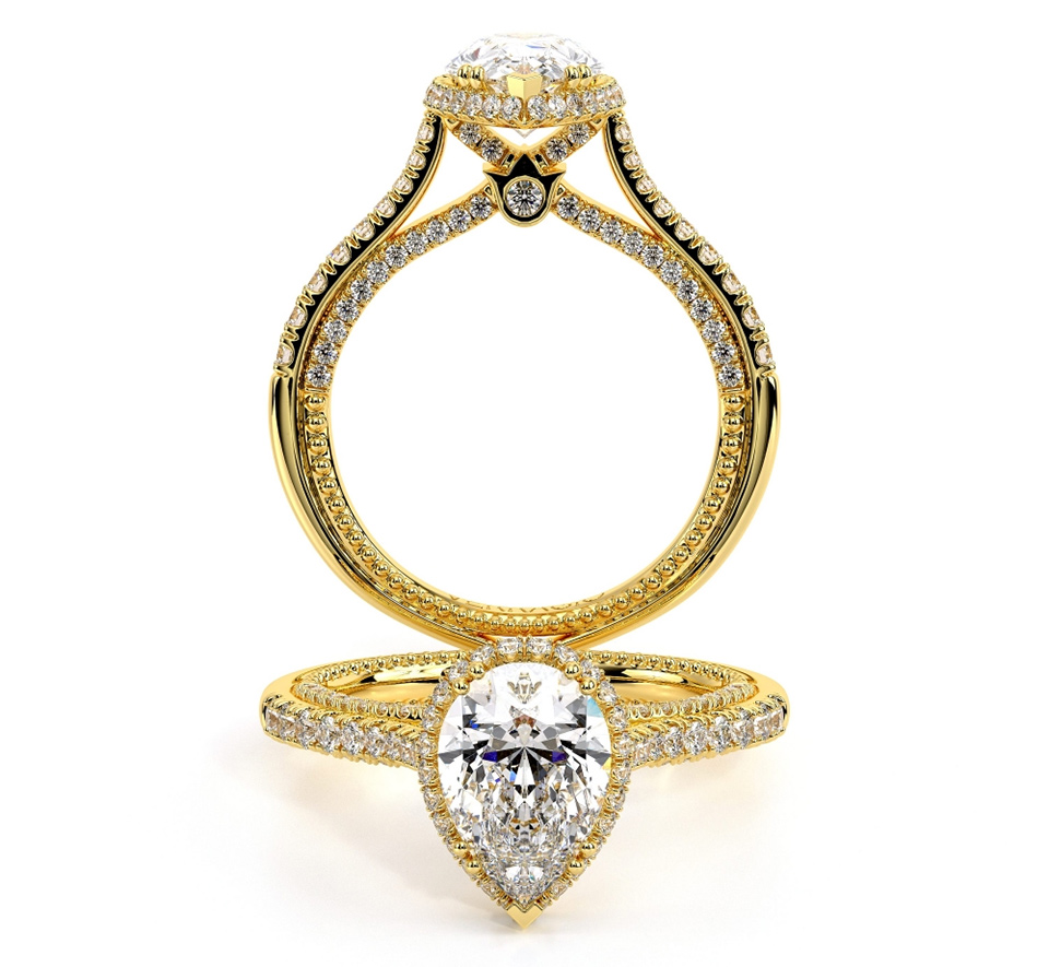 a gold pear cut engagment ring