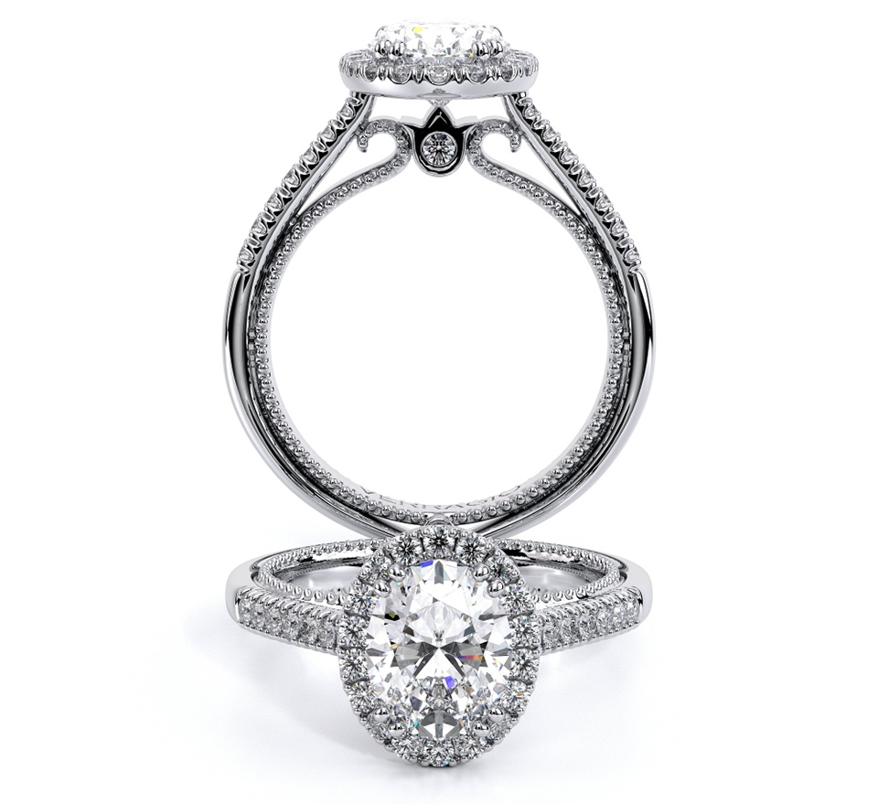 a silver oval cut diamond studded engagement ring