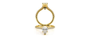 a renaissance engagement ring in rose gold