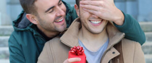 man proposing to boyfriend covering eyes